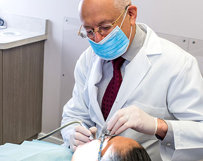 Dr. Rosenson working on a patient