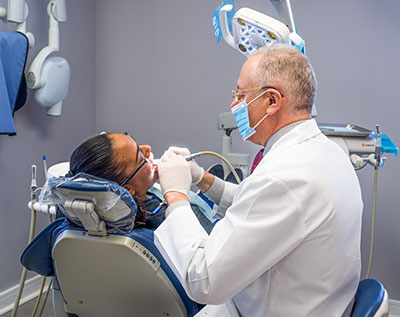 Victor Rosenson working on a patient